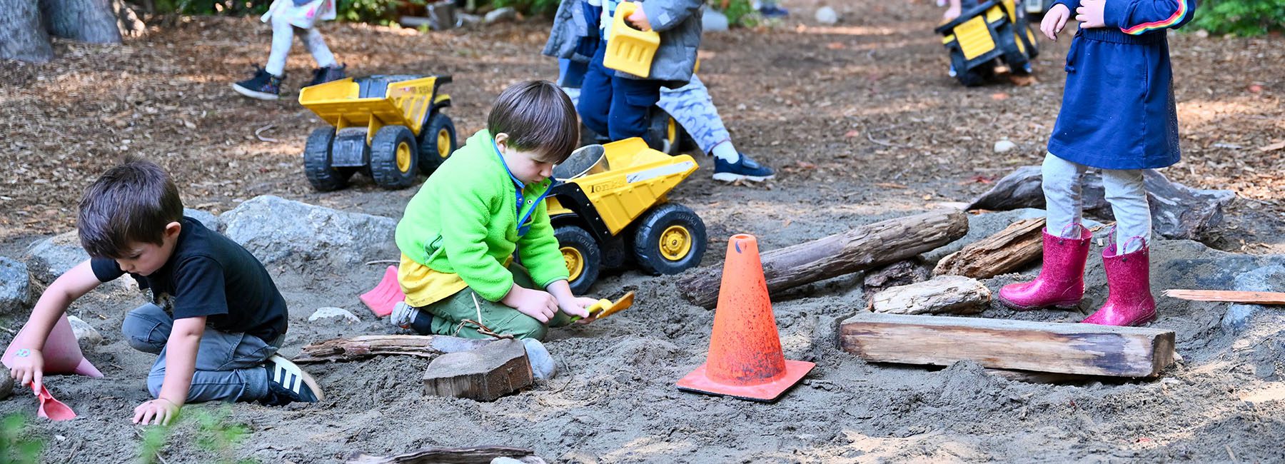 Kids playing in outdoor sandbox