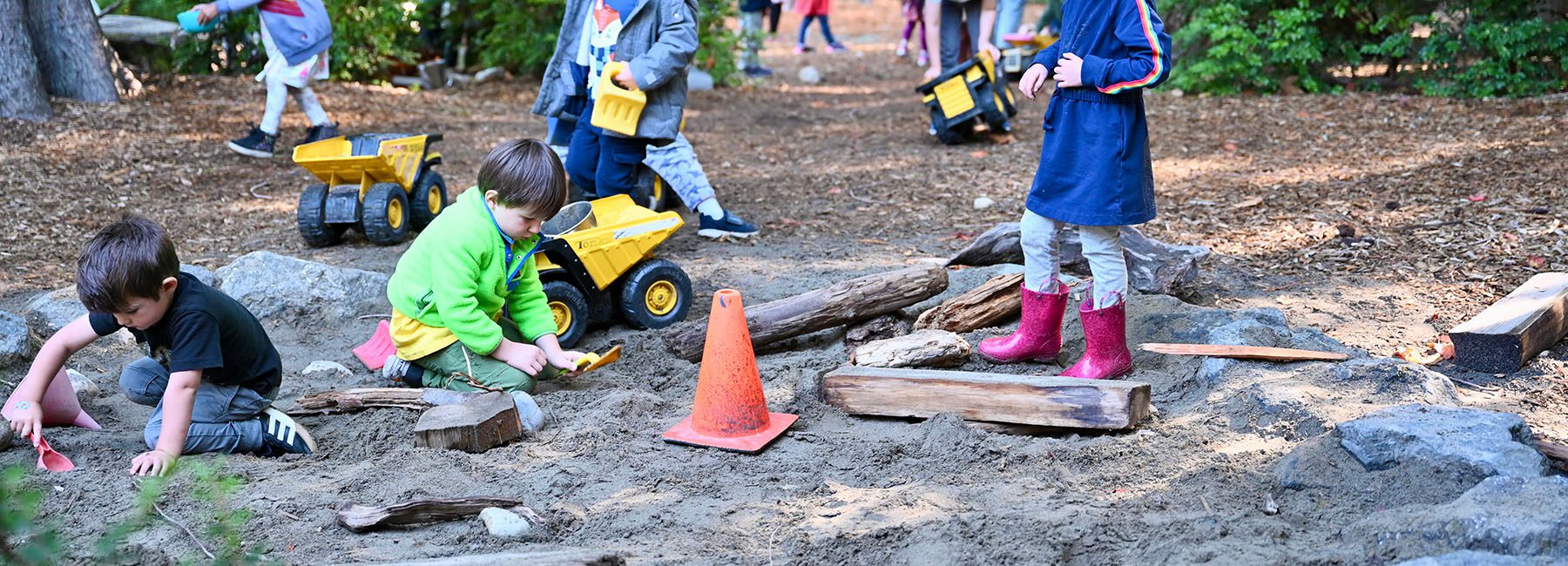 Kids playing in outdoor sandbox