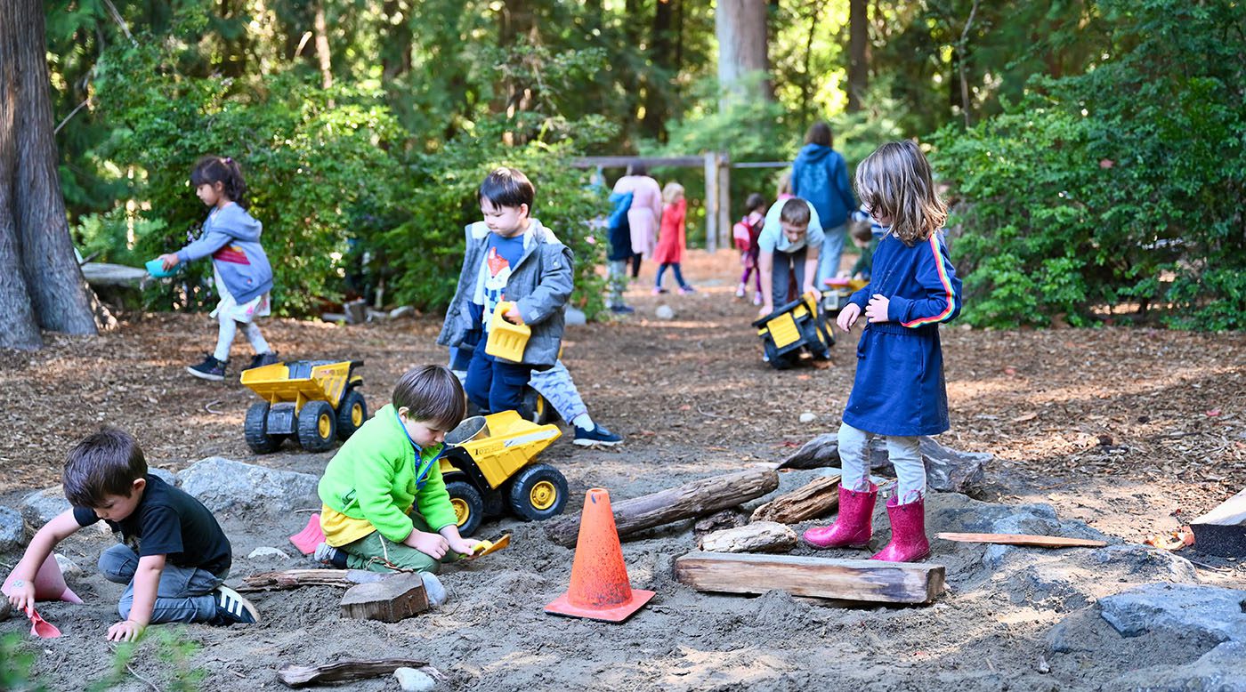 Kids playing in outdoor sandbox